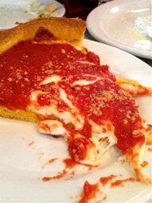 It's impossible to get a neat slice out of the deep-dish pizza pans at Gino's East. As you can see, it's all about the cheese.
