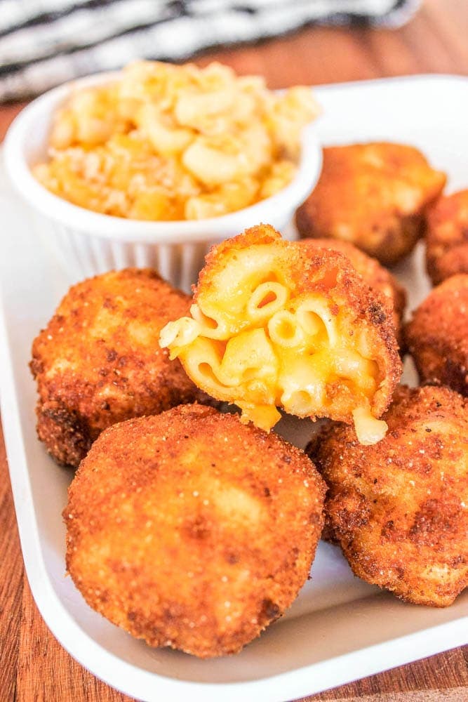 Fried Mac and Cheese Bites served on a white tray.