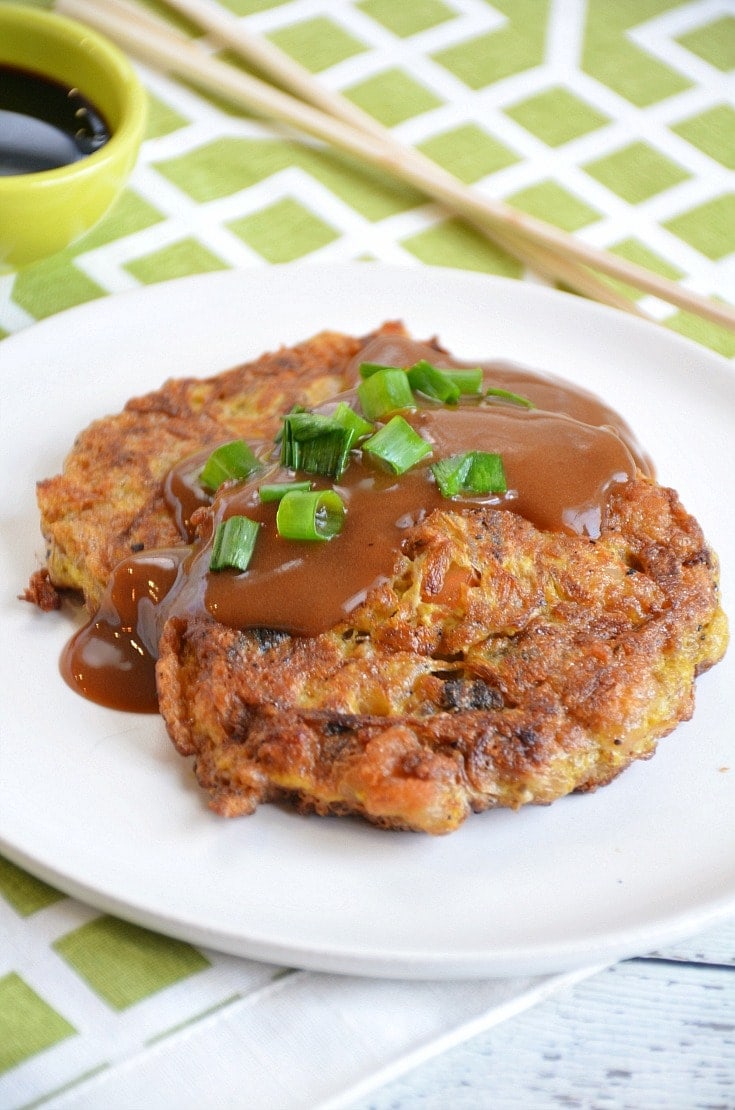 Finished egg foo young on a white plate.