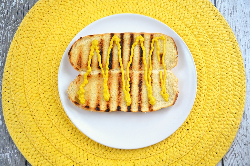 hot dog bun with mustard