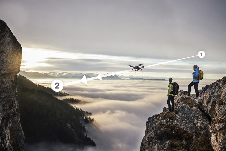 two female hiker above the sea of fog on top of a mountain