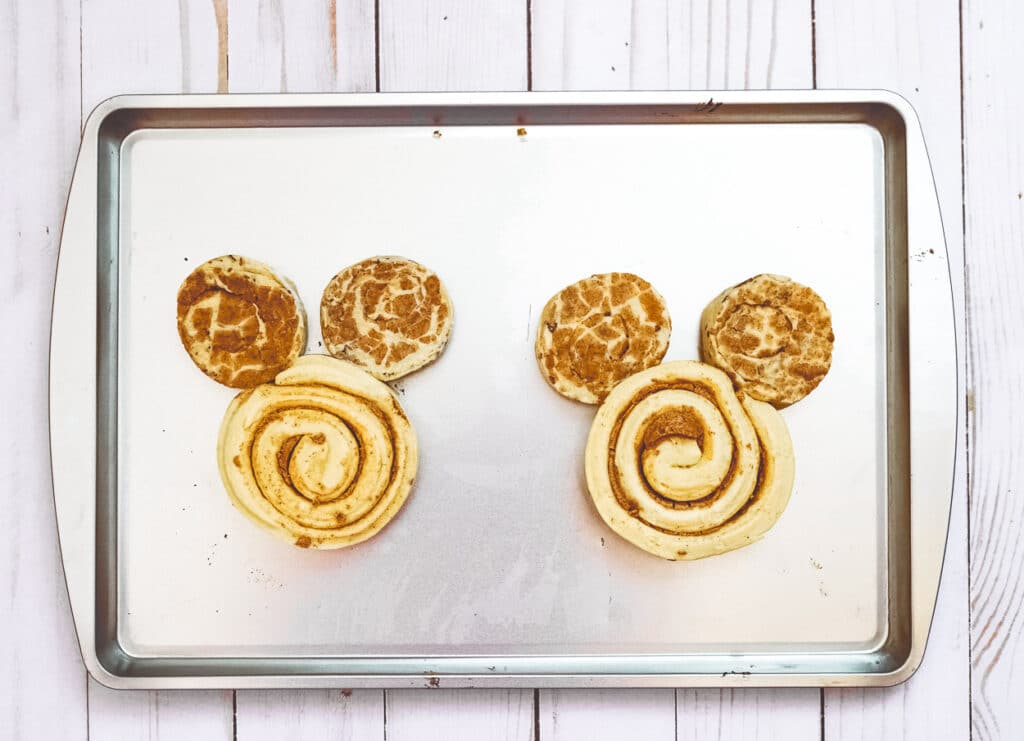 giant mickey cinnamon rolls made with 1 grande cinnamon roll and 2 regular cinnamon rolls