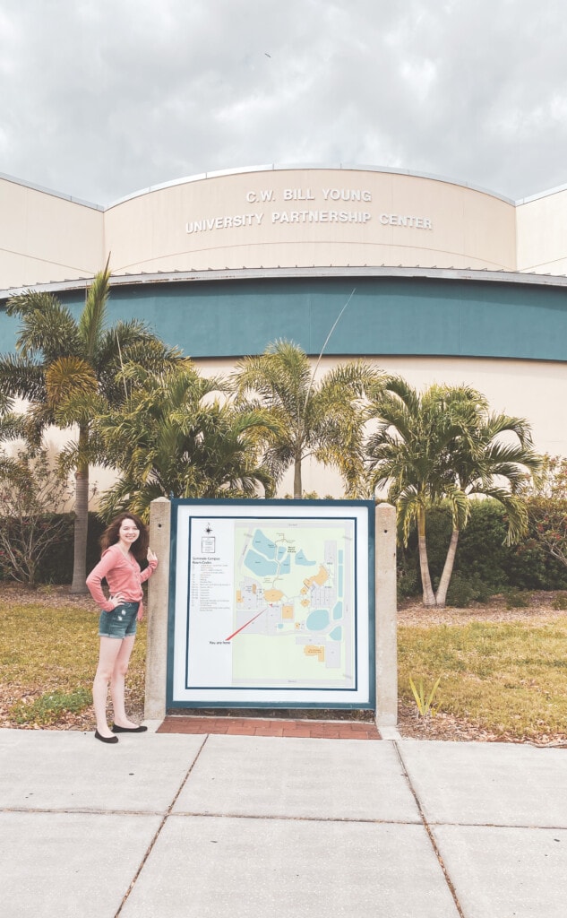 girl in front of campus campus map for florida prepaid