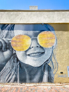 little girl in sunglasses mural downtown st. pete florida