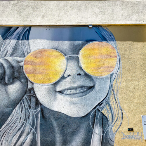 little girl in sunglasses mural downtown st. pete florida