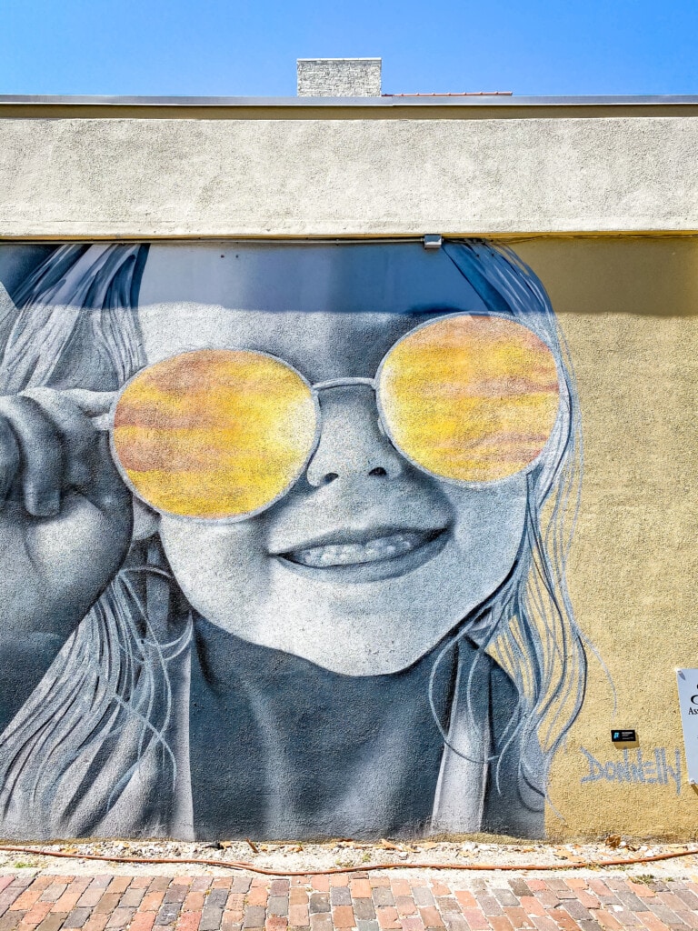 little girl in sunglasses mural downtown st. pete florida