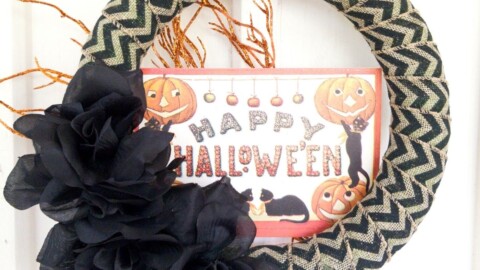 Happy Halloween wreath on white wall