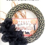 Happy Halloween wreath on white wall