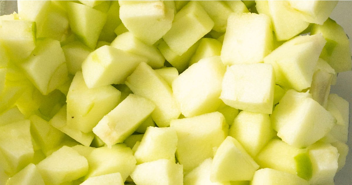 in-process step of chopped apples to make crockpot apple butter