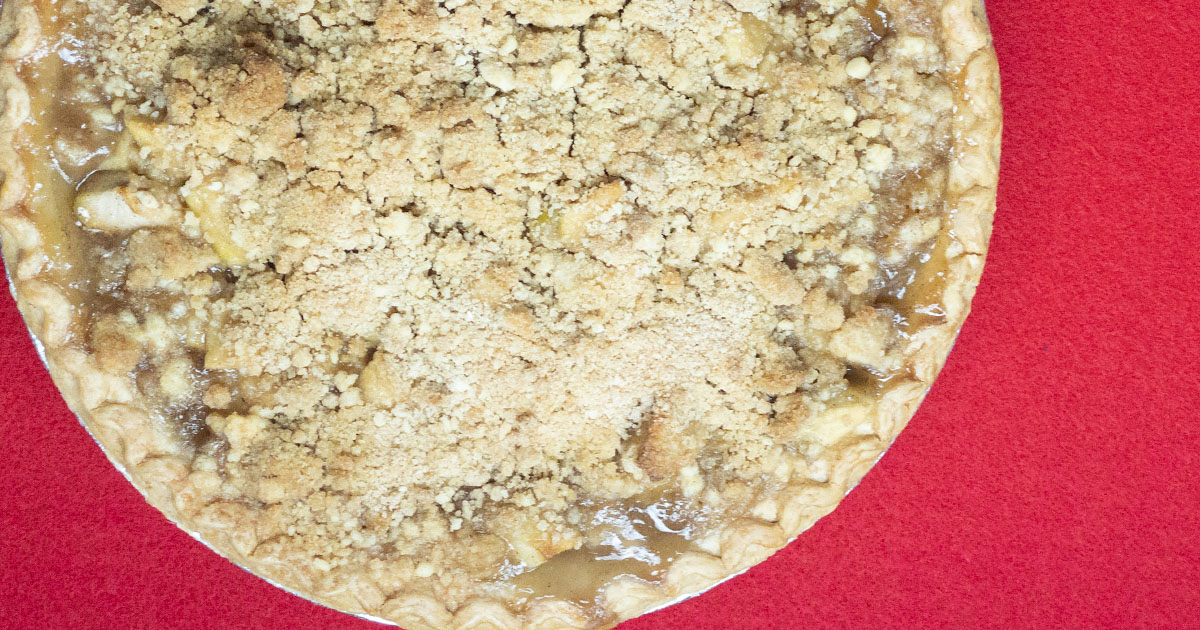 overhead view of crumble topped apple pie