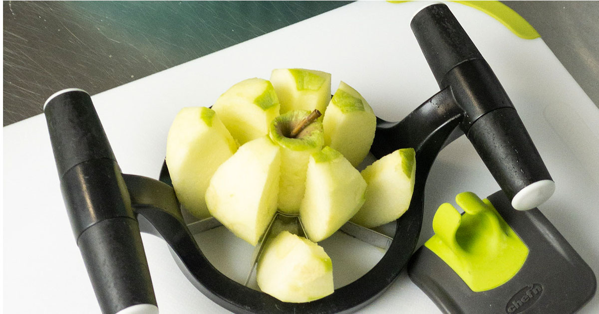 in-process step of slicing apples to make apple pie