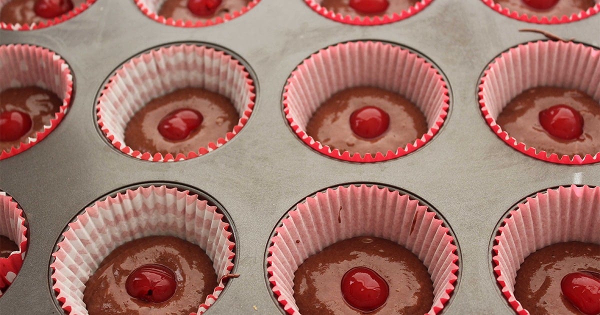 in-process step of making cherry filled cherry coke cupcakes