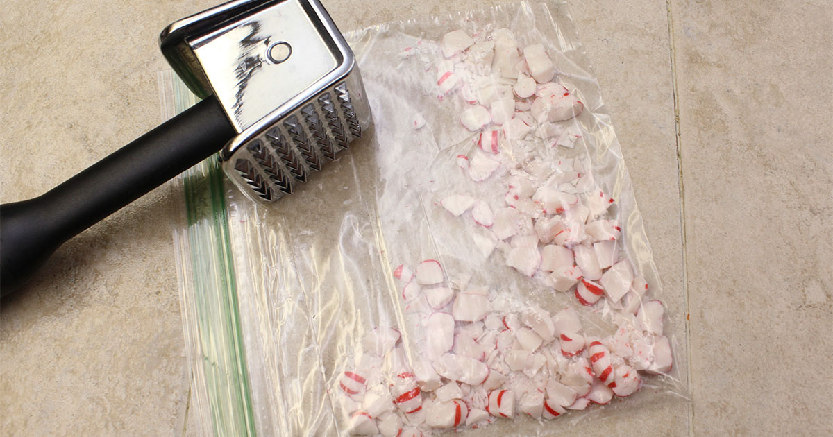 in-process step of crushing peppermints to make chocolate peppermint candy recipe