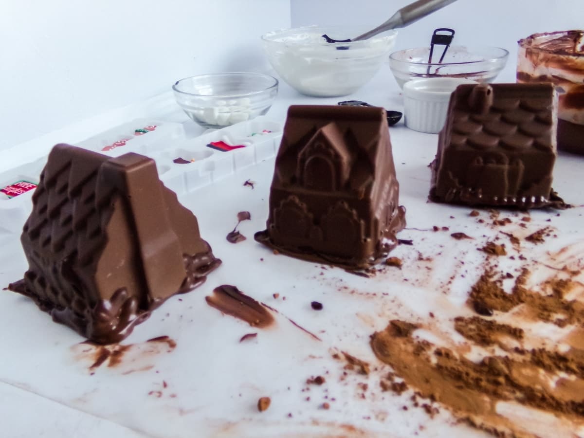 in-process step of making Gingerbread House Hot Cocoa Bombs by getting them ready to decorate