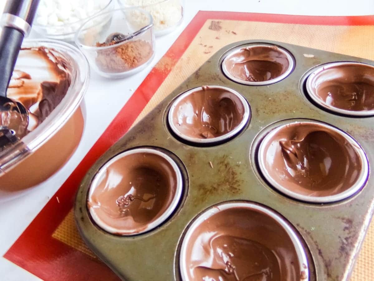 filled molds to make Almond Joy Hot Cocoa Bombs