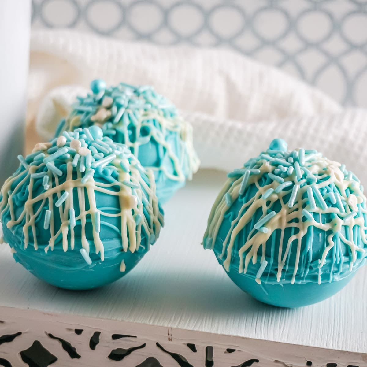 Frozen Hot Cocoa Bombs on a white table