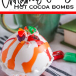 closeup of a white chocolate hot cocoa bomb with text which reads Old Fashioned Christmas Candy Hot Cocoa Bombs