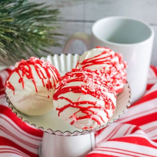 Peppermint Hot Cocoa Bombs on a white cupcake tray