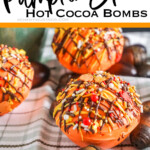 pumpkin spice hot cocoa bombs with text which reads pumpkin spice hot cocoa bombs
