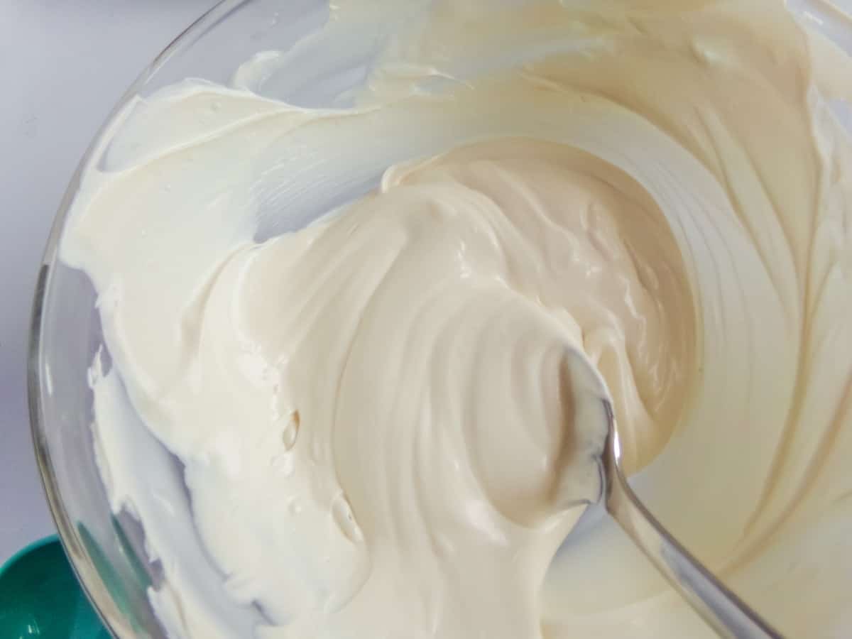 melted white chocolate to make Snowman Hot Cocoa Bombs