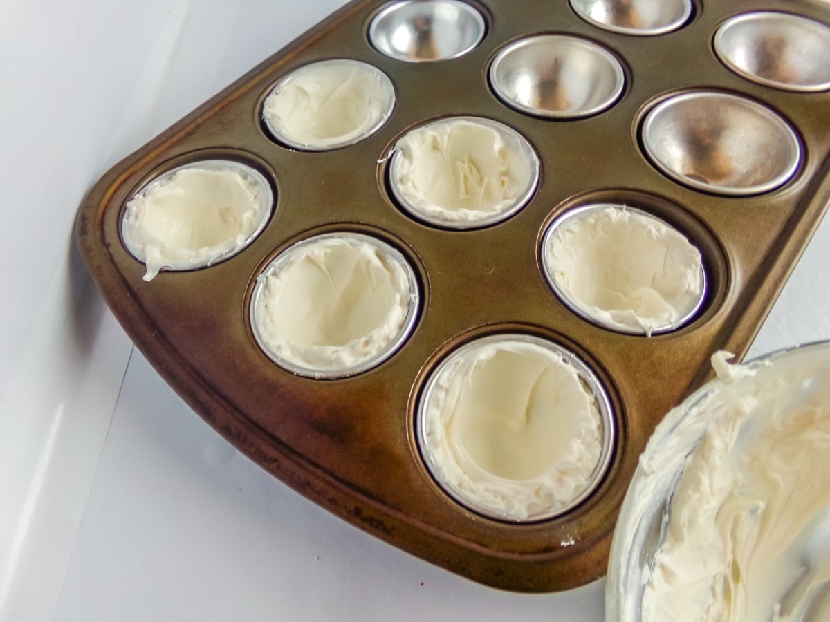 chocolate filled molds to make Snowman Hot Cocoa Bombs