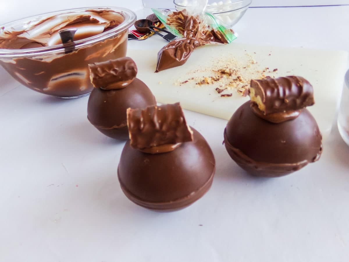 overhead view of twix hot cocoa bombs