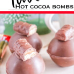 closeup of twix hot chocolate bombs with text which reads twix hot cocoa bombs
