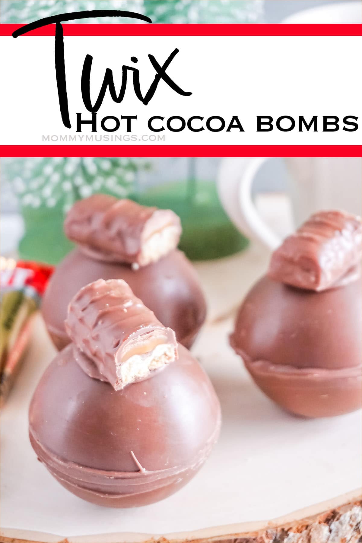 closeup of twix hot chocolate bombs with text which reads twix hot cocoa bombs