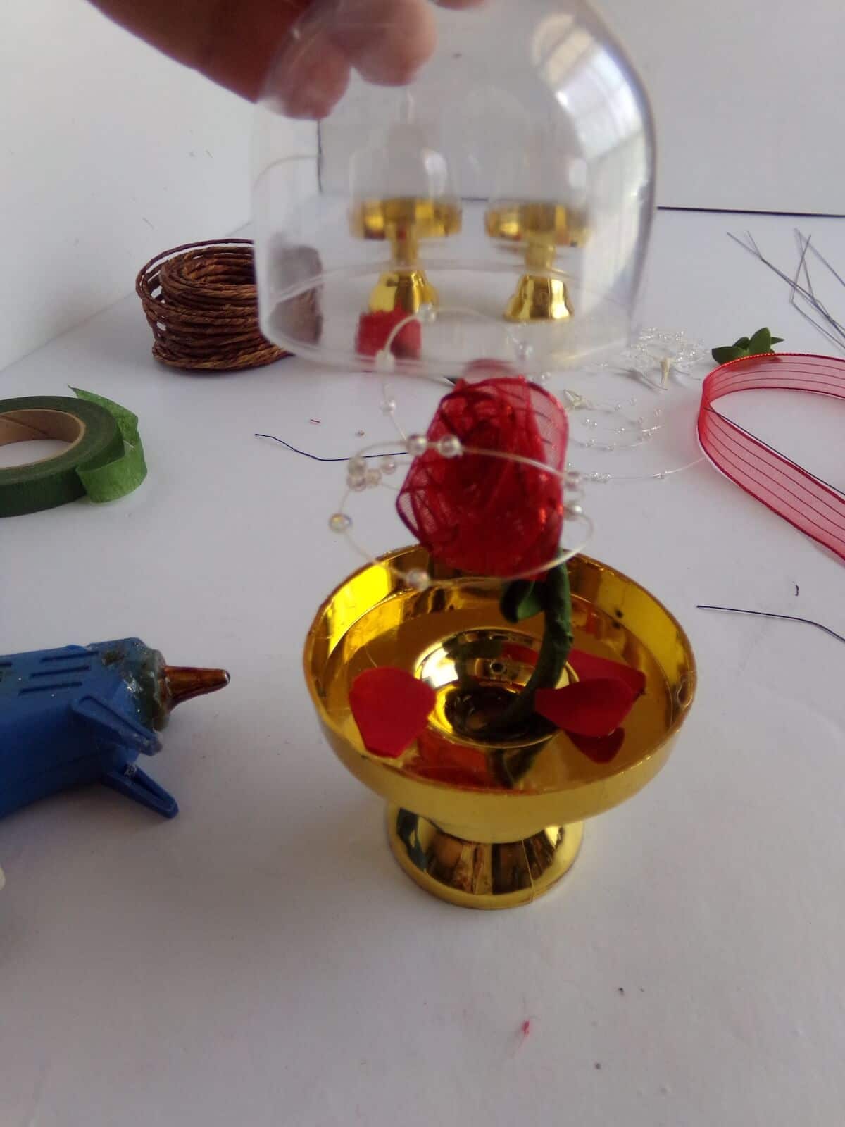 putting a lid on a princess belle ornament