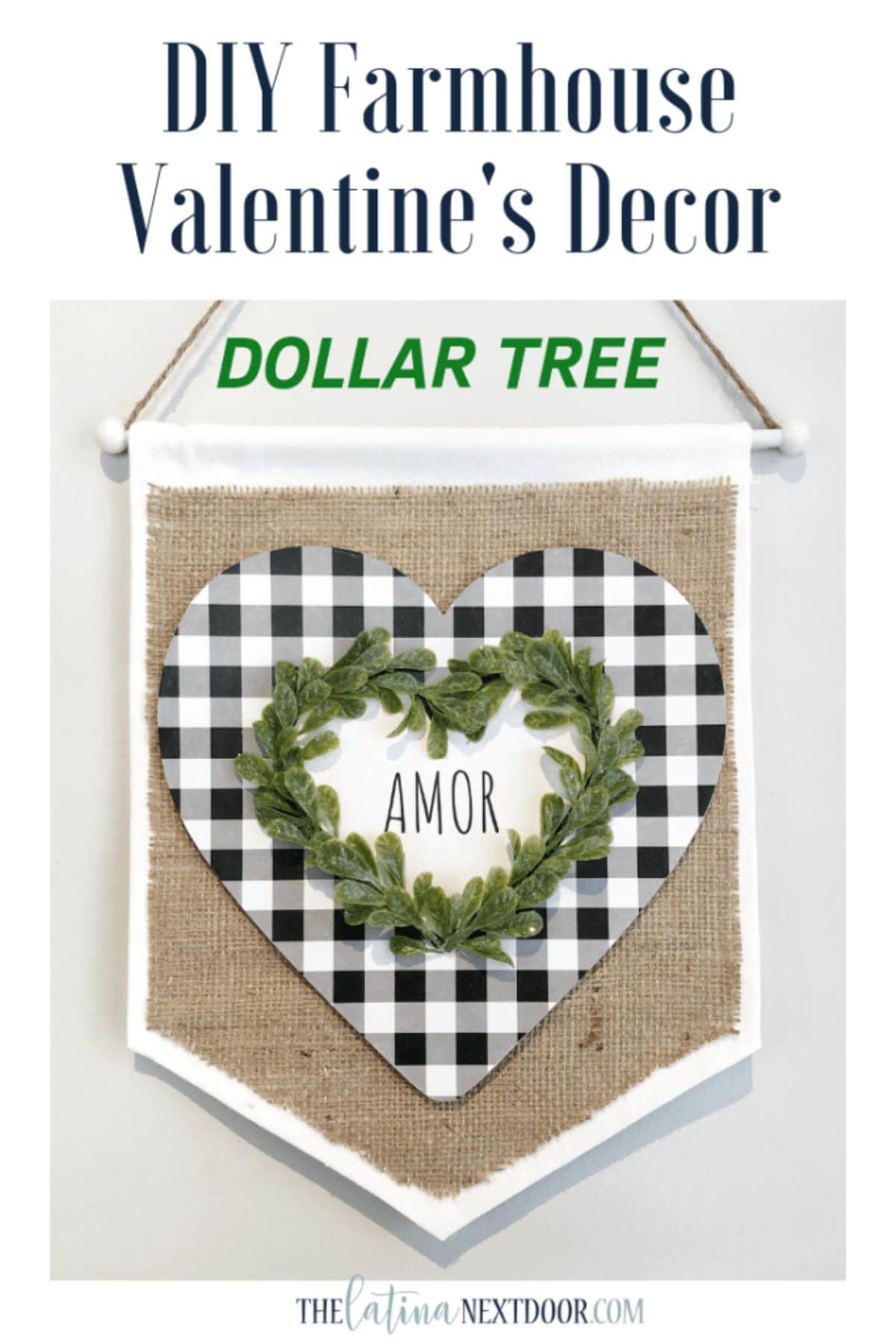 UNder the text DIY Farmhouse Valentine's Decor Dollar Tree, sits a burlap pennant with a white frame. On top of teh burlap is a heart in black and white check On top of that is a heart in foliage and the word "Amor" inside.