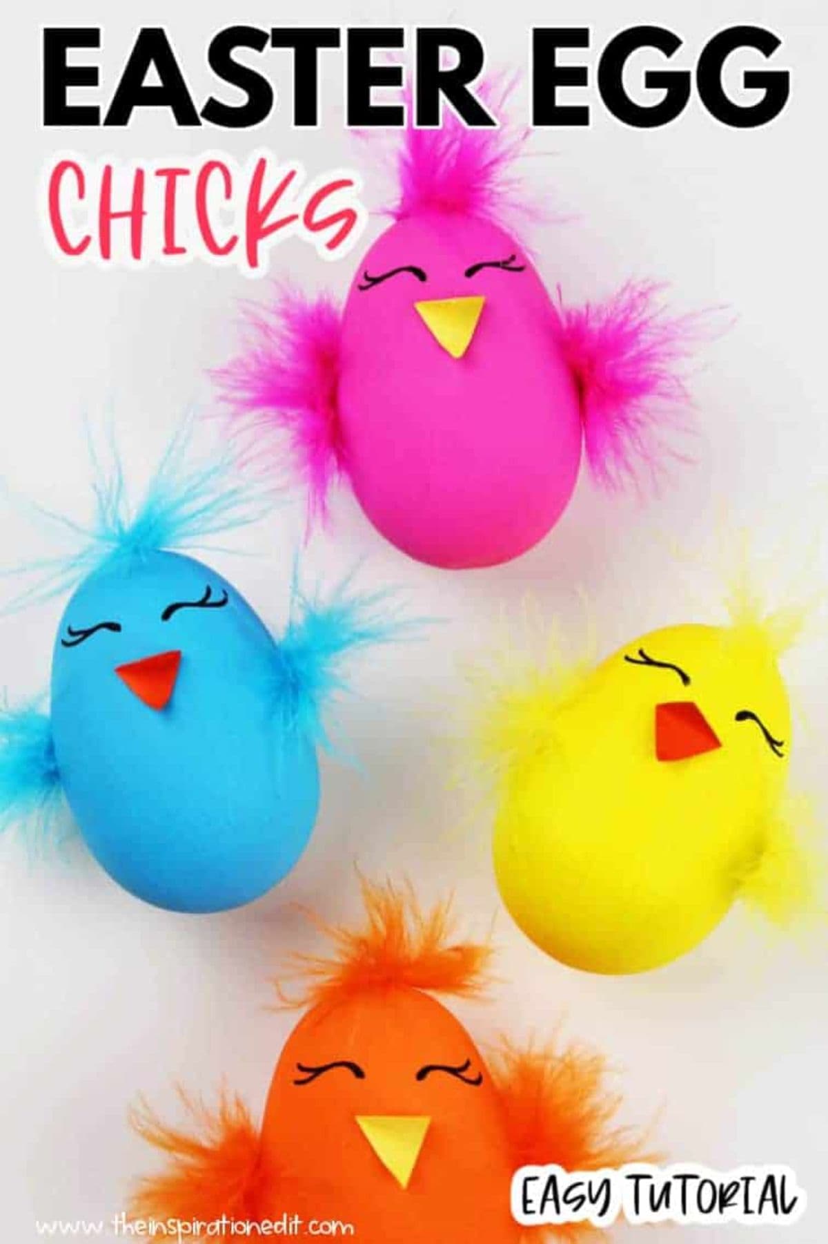 four colored eggs turned into chicks with craft feathers