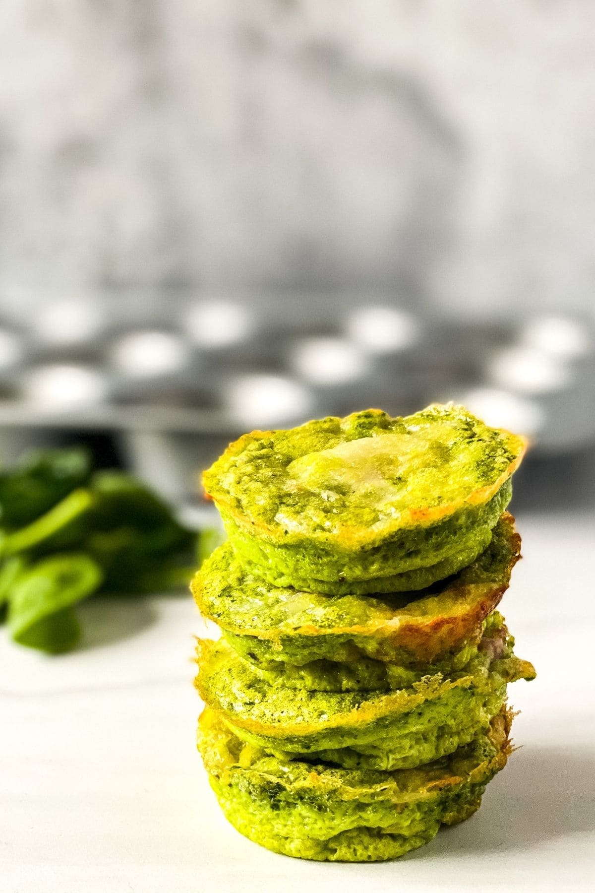 Stack of green eggs and ham muffins