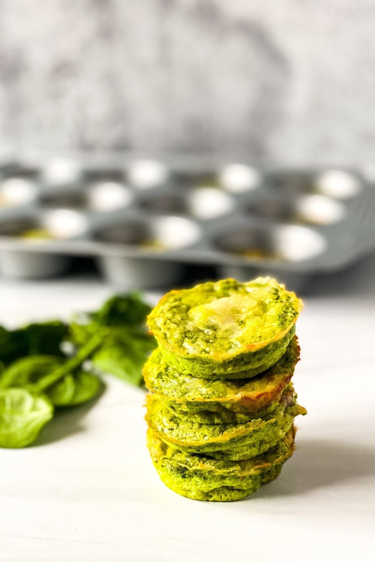 Stack of green eggs and ham muffins