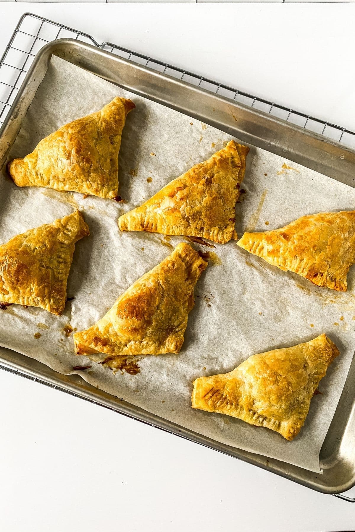 Puff pastry pizza on baking tray