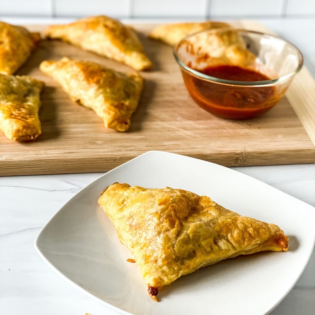 Puff pastry pizza snack on plate