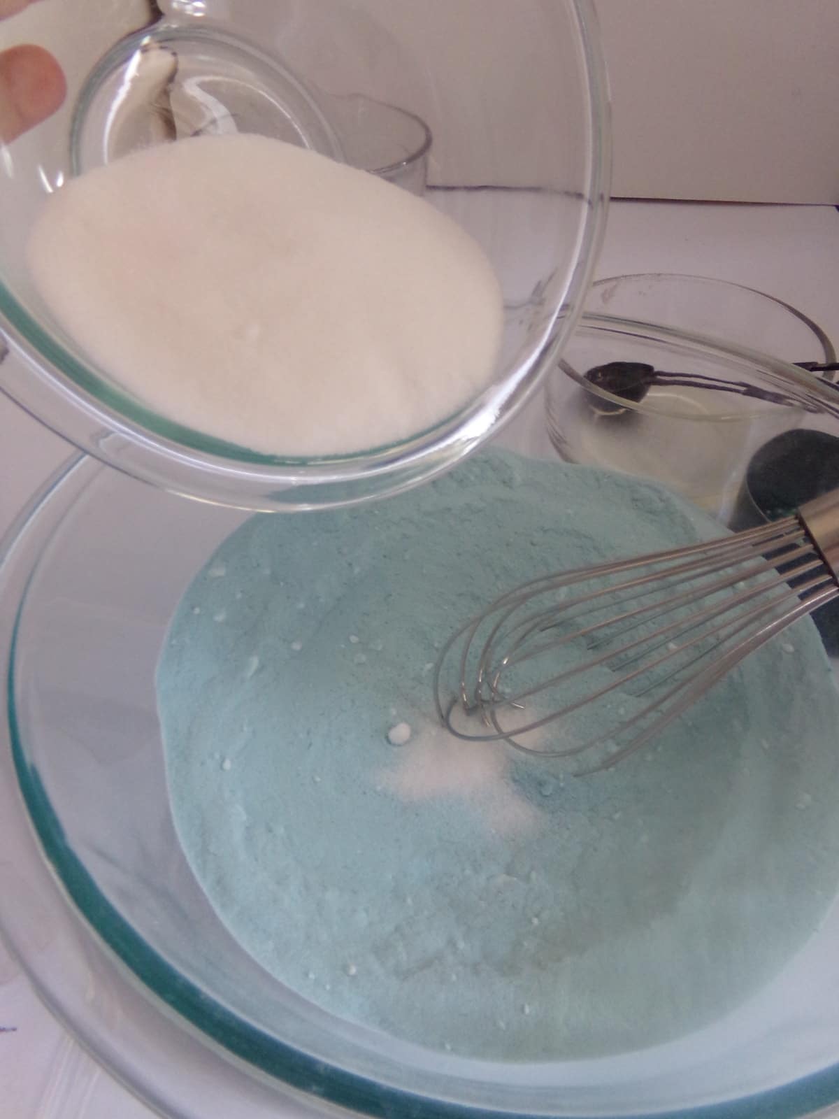 in-process step of mixing ingredients to make mermaid shell bath bombs