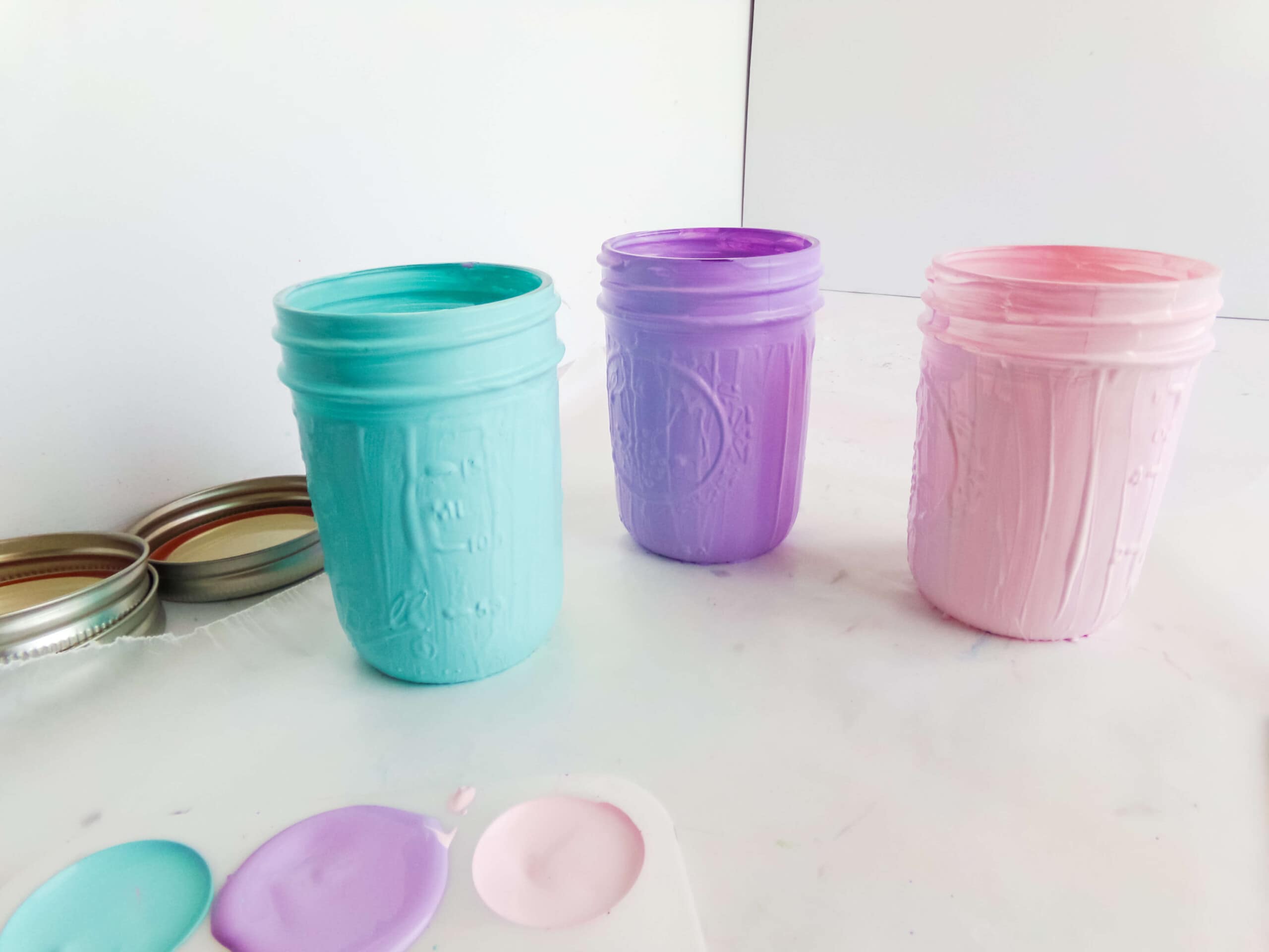 step one of painting the jars to make unicorn jars