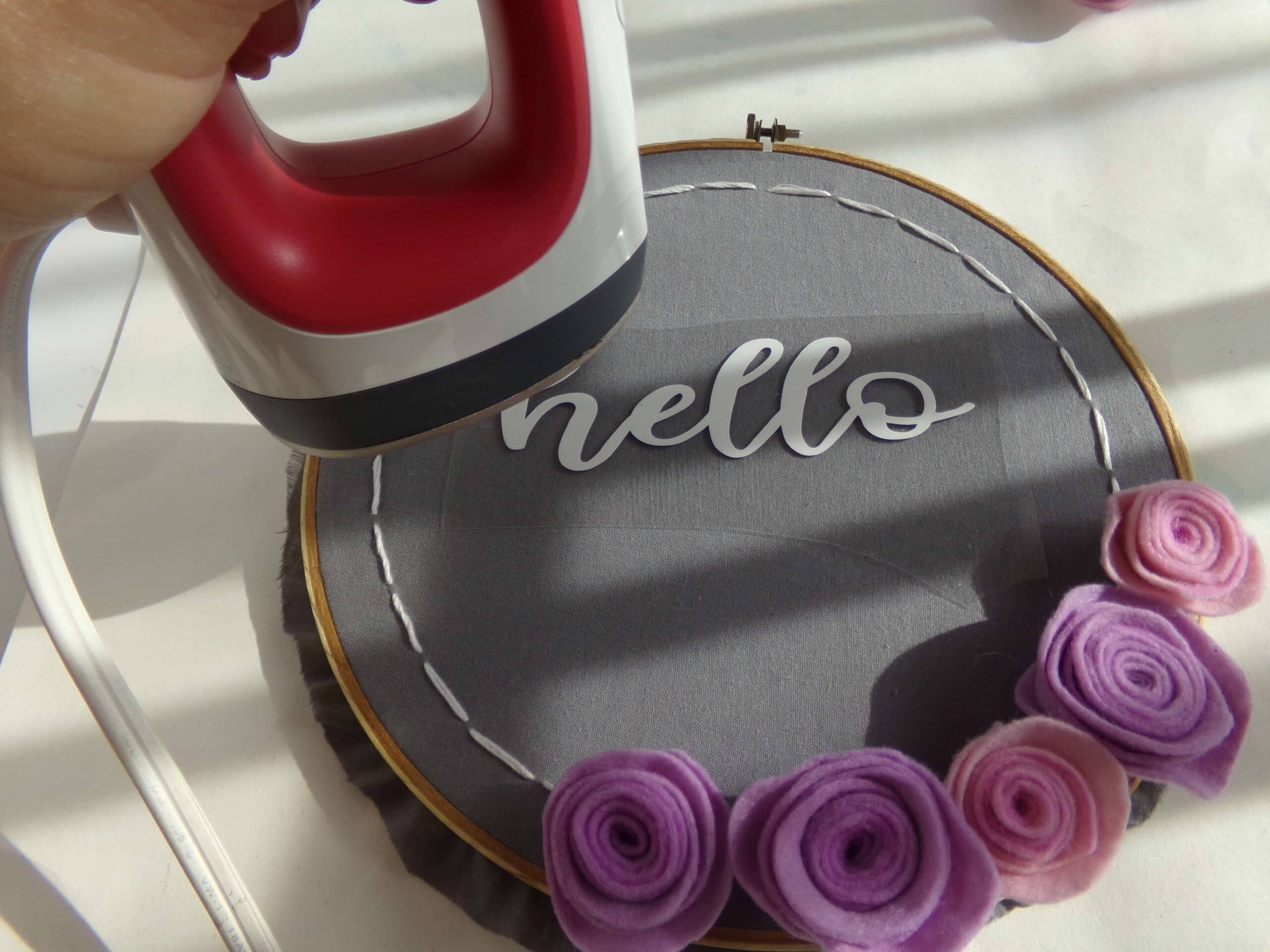 adding cricut cut lettering to a wreath for an embroidery hoop wreath