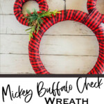 easy disney inspired winter wreath with text which reads mickey buffalo check wreath