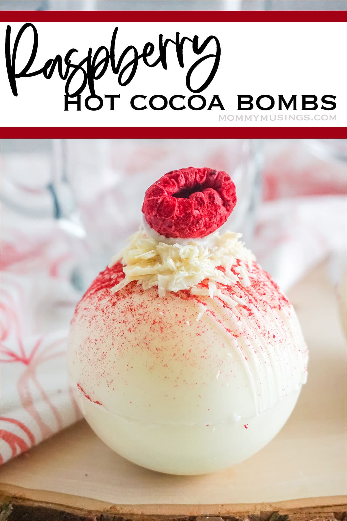 raspberry topped white chocolate hot cocoa bombs with text which reads raspberry hot cocoa bombs