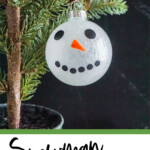 easy cricut made snowman ornament for christmas with text which reads snowman ornament