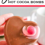 hand holding a heart shaped hot cocoa bombs with text which reads swirl heart hot cocoa bombs