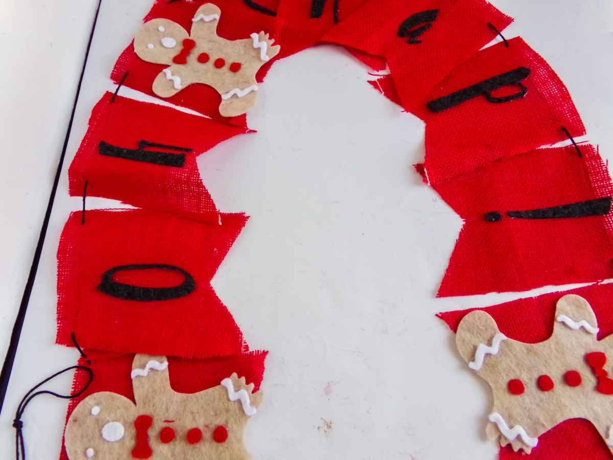 in-process step of making a gingerbread man garland