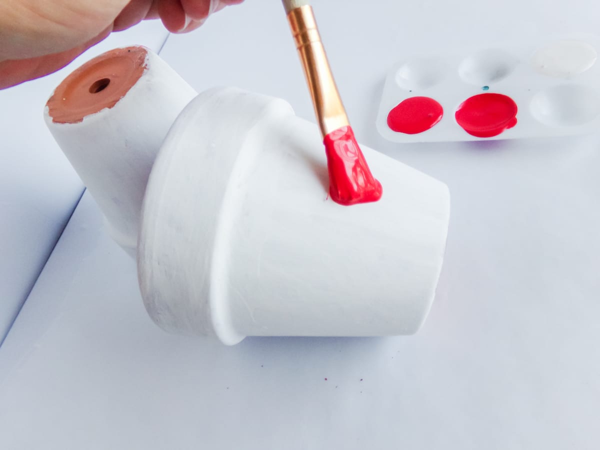 in-process step of making a set of mickey and minnie flower pots