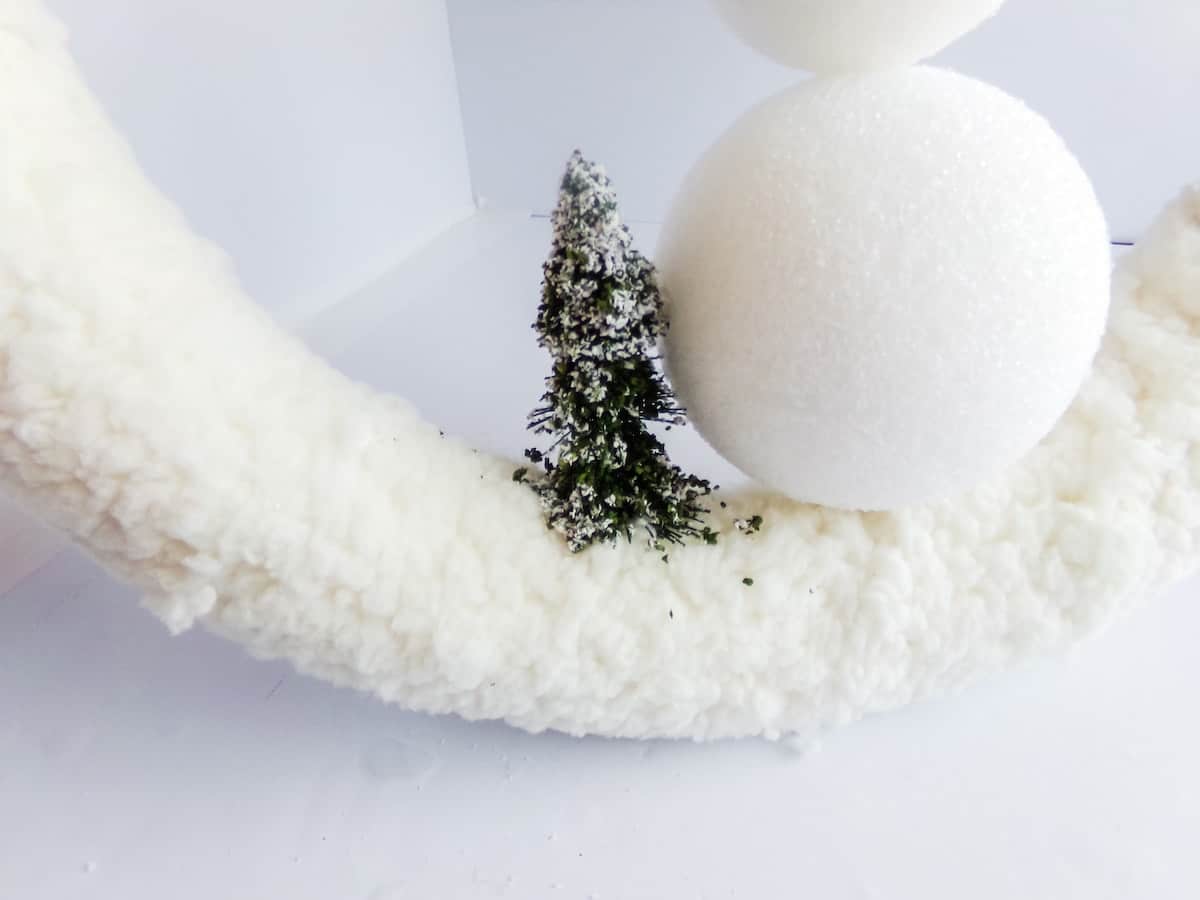 in-process step of making a Mickey mouse snowman wreath