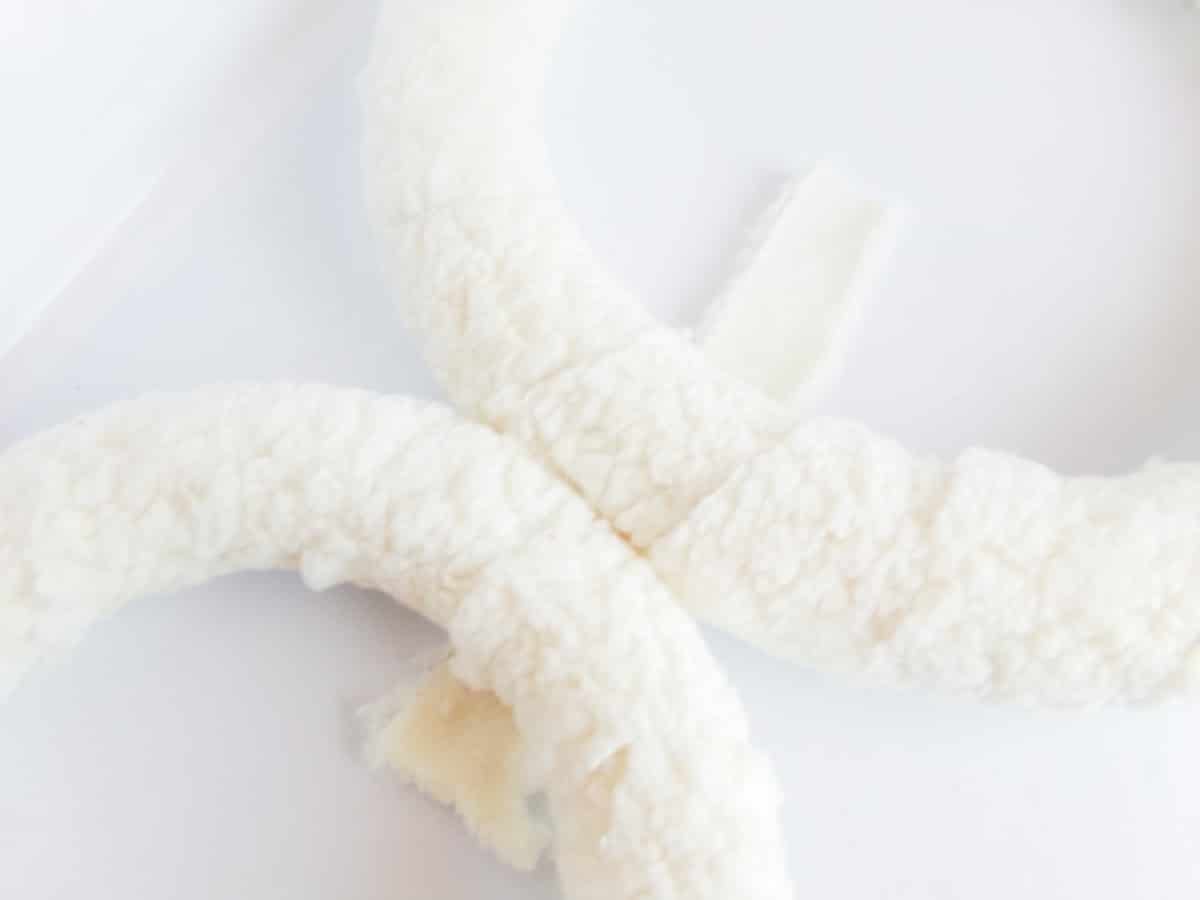 in-process step of making a Mickey mouse snowman wreath