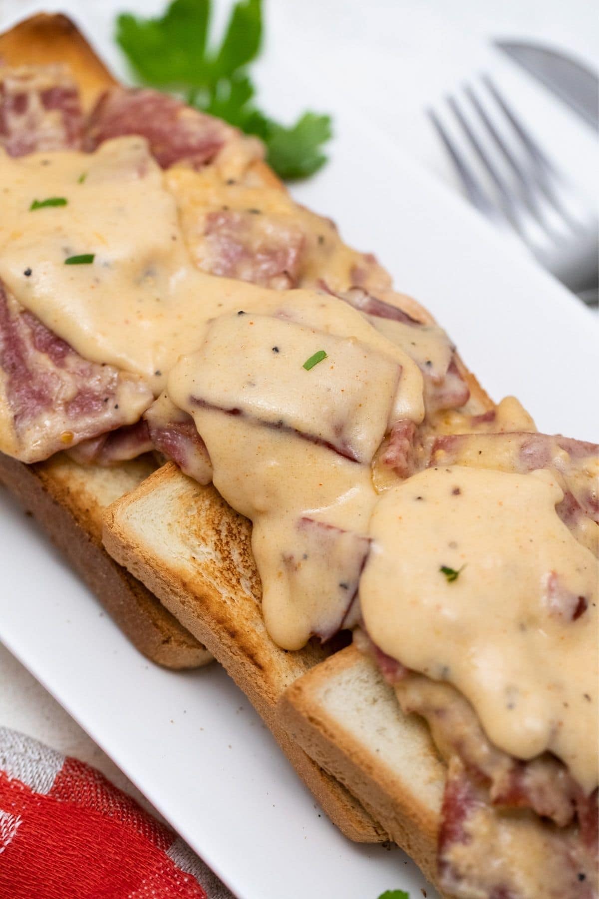 creamed chipped beef over toasted bread on white platter