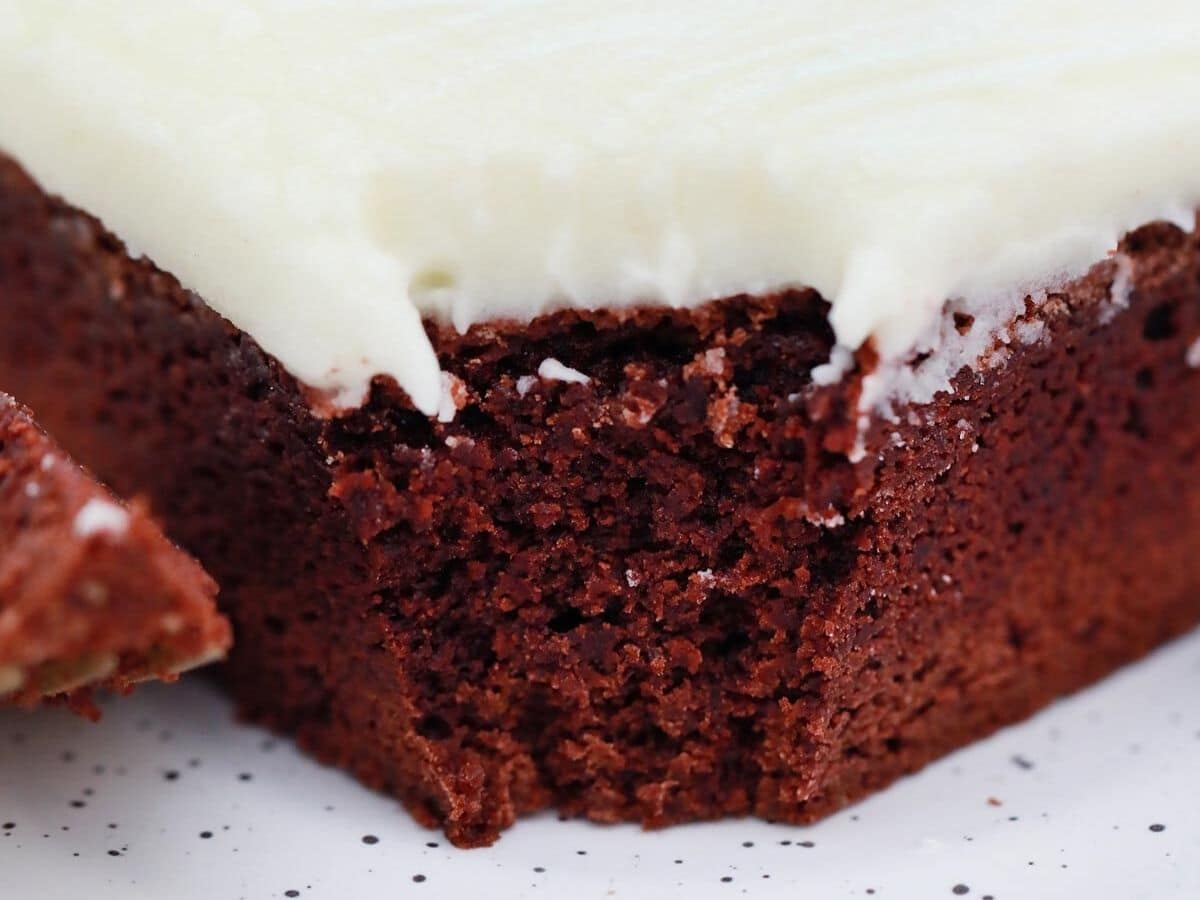 red velvet brownie with cream cheese icing and a bite taken out