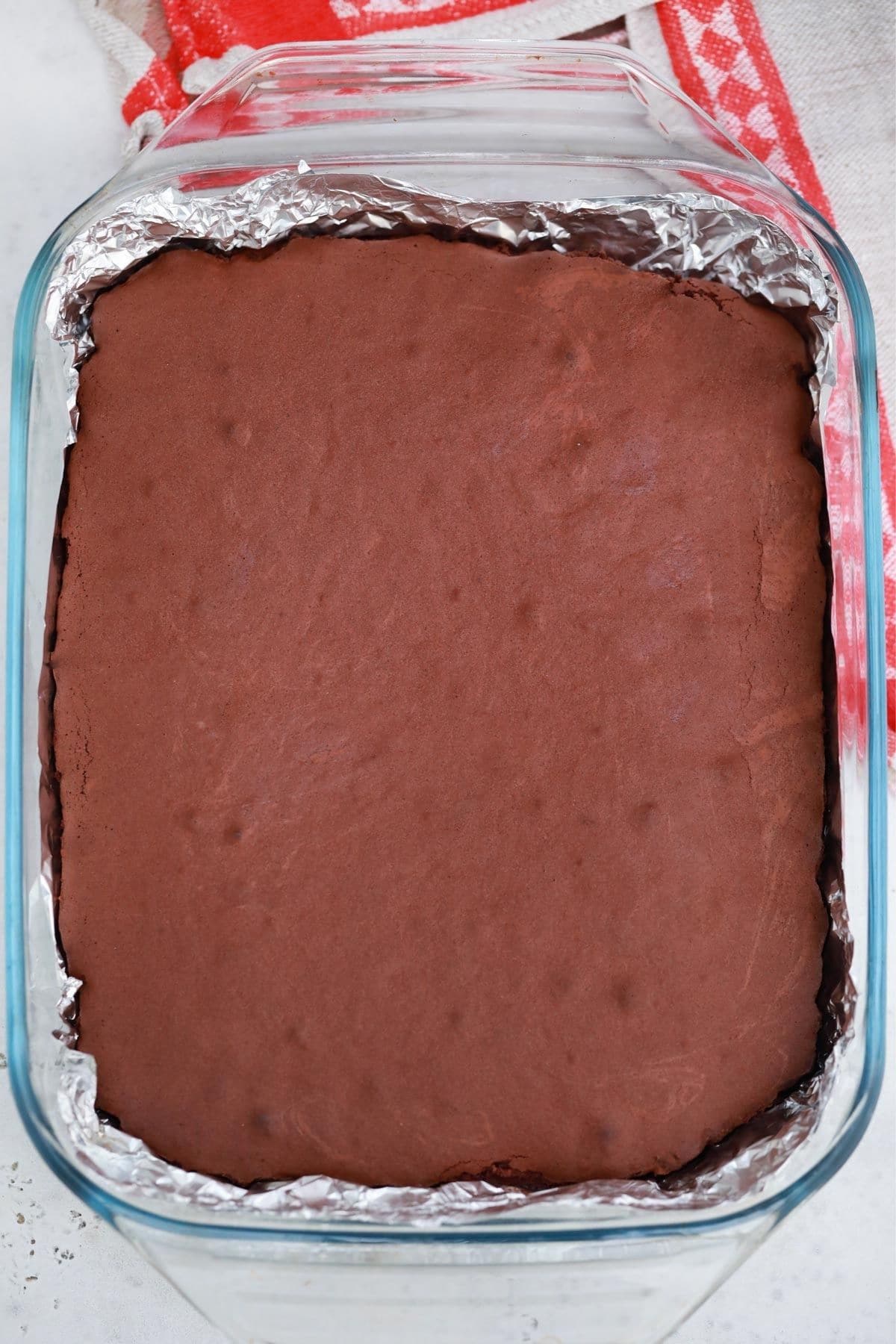 baked brownies on table with red and white napkin