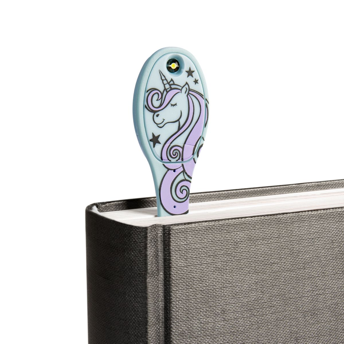 unicorn bookmark in top of black book